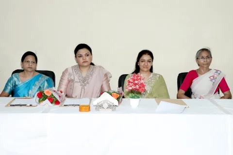 Guests and school leaders seated with students during the award ceremony