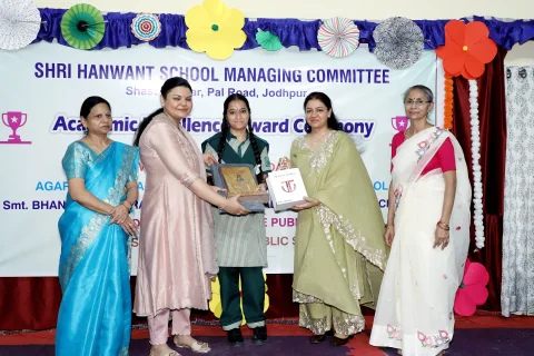 Prize distribution to a student from the HSMC board-level schools