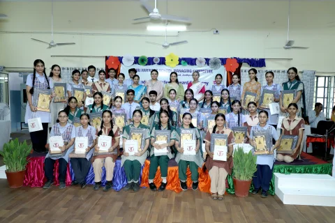 Group photo of RBSE board achievers from HSS, AJDG and BDRKA holding awards on stage